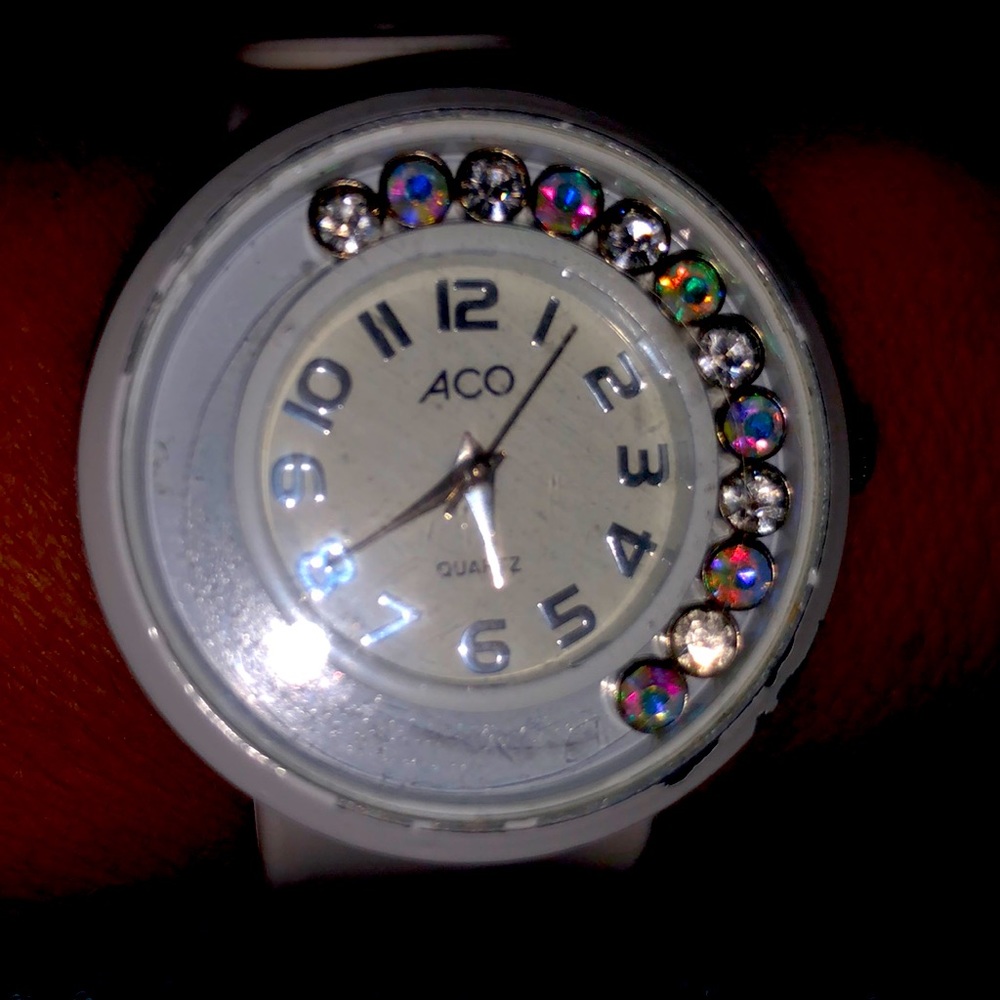 Ladies vintage used white expandable band watch with floating crystals.
